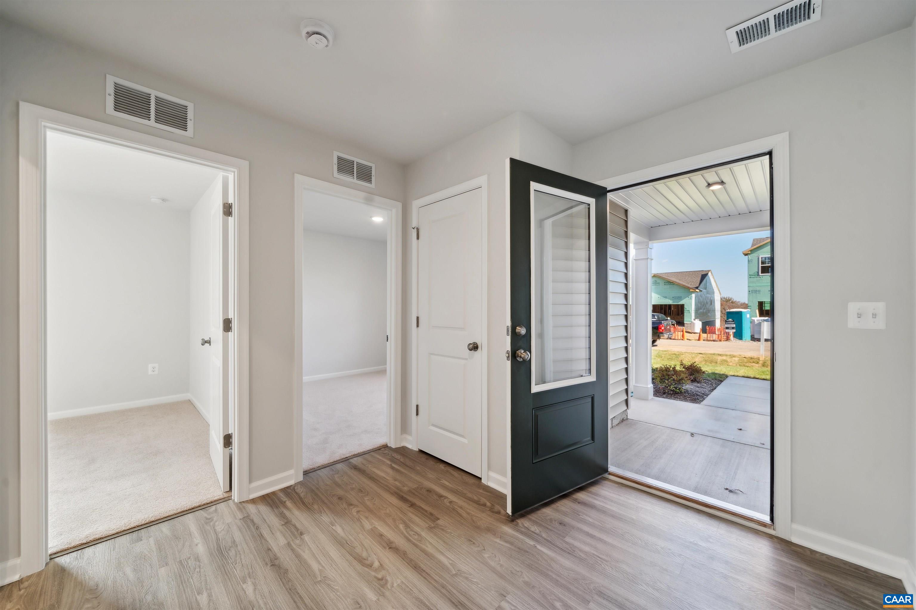 53 Horse Path Drive Palmyra, VA 22963 - Photo 3 of 26 a view of an empty room and bathroom with wooden floor