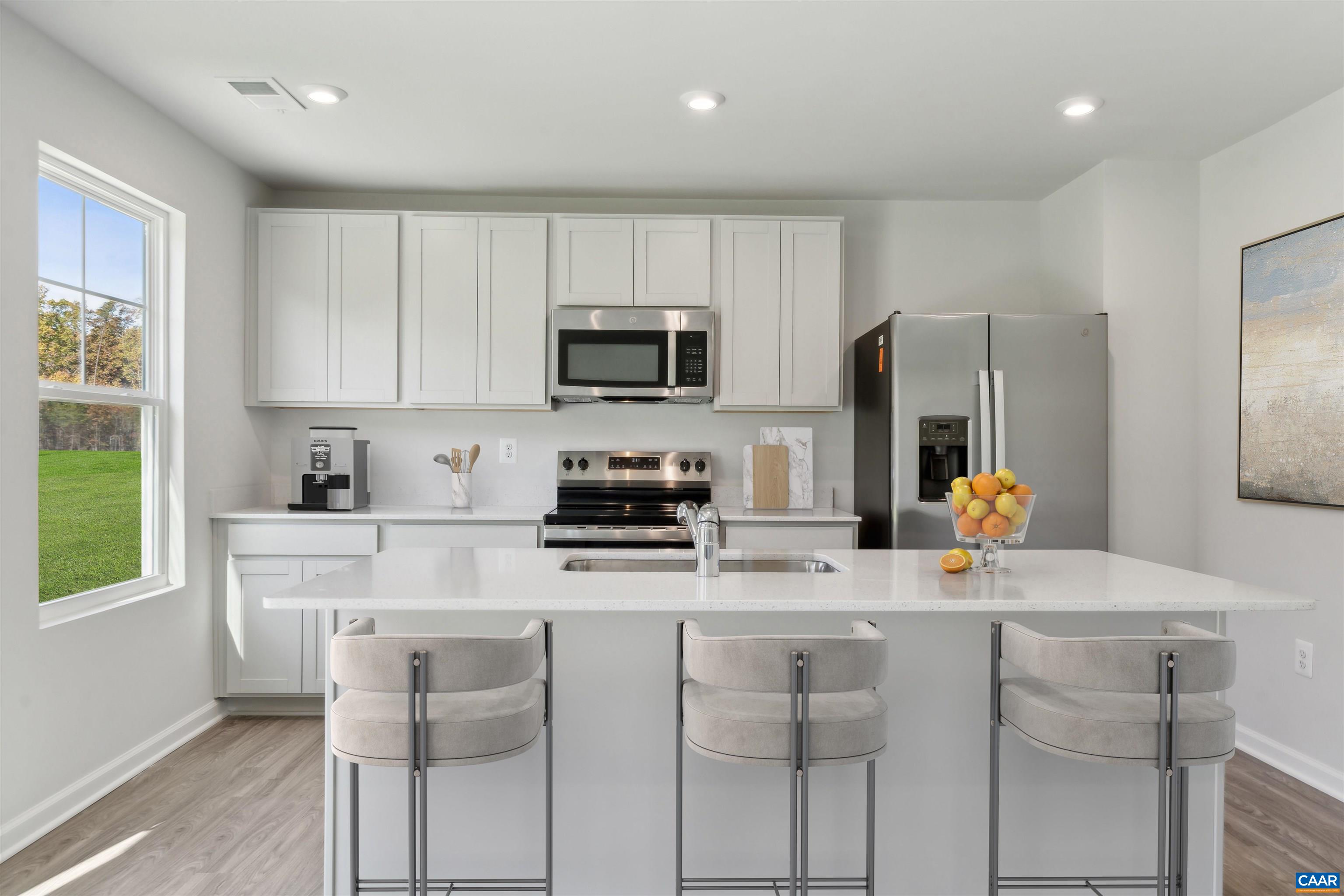 53 Horse Path Drive Palmyra, VA 22963 - Photo 8 of 26 a kitchen with appliances cabinets and a counter top space