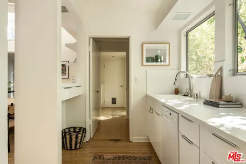 a view of walk in closet with clothes