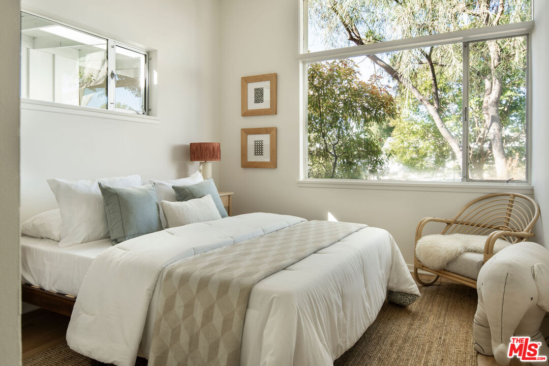 6006 Babbitt Avenue Encino, CA 91316 - Photo 20 of 32 a bedroom with bed and a window