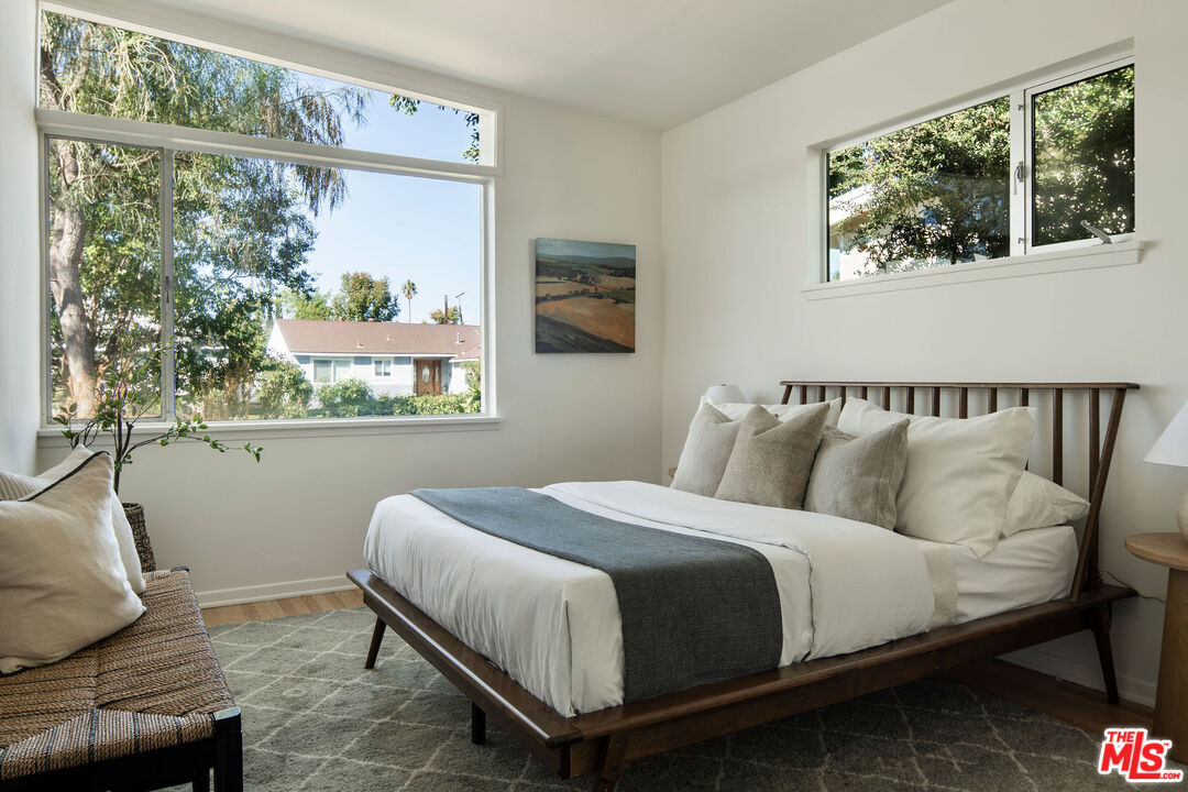 6006 Babbitt Avenue Encino, CA 91316 - Photo 23 of 32 a bedroom with a bed and window