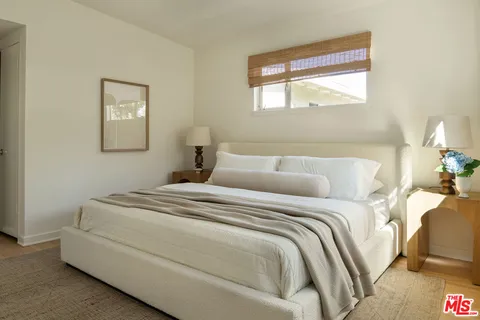 a bathroom with a shower sink and mirror