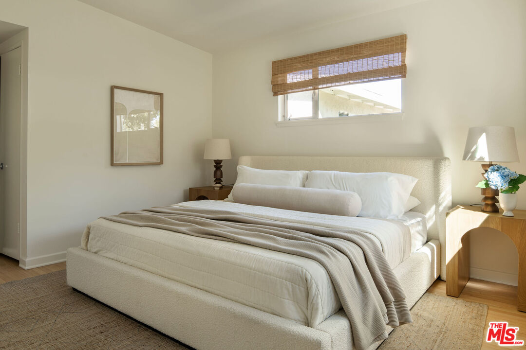 6006 Babbitt Avenue Encino, CA 91316 - Photo 24 of 32 a bedroom with a bed and a window