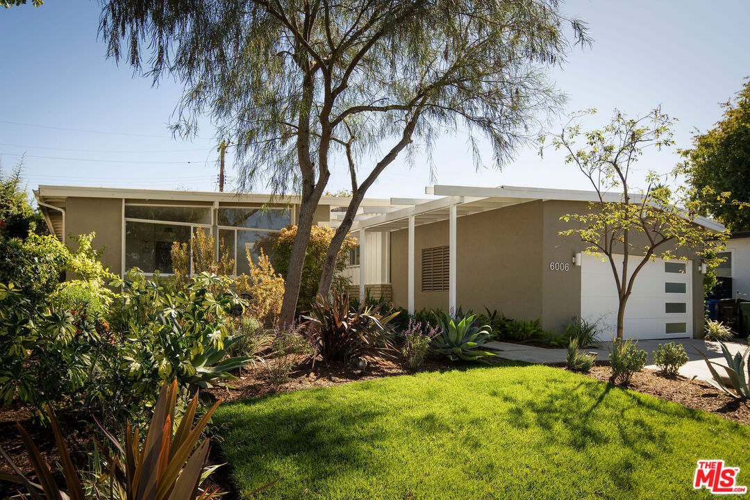 6006 Babbitt Avenue Encino, CA 91316 - Photo 31 of 32 a front view of a house with a yard