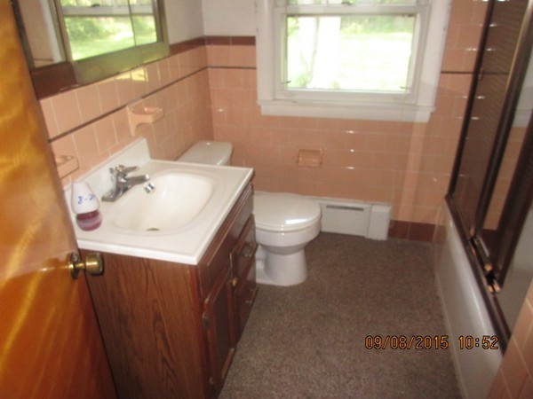 68 Durfee Road Tiverton, RI 02878 - Photo 15 of 22 a bathroom with a sink a toilet and a mirror
