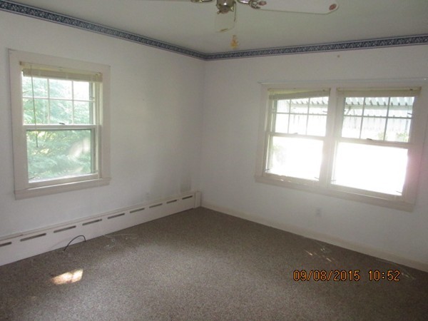 68 Durfee Road Tiverton, RI 02878 - Photo 18 of 22 an empty room with a window