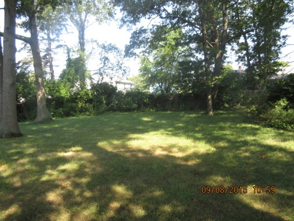 68 Durfee Road Tiverton, RI 02878 - Photo 2 of 22 a backyard of a house with lots of green space