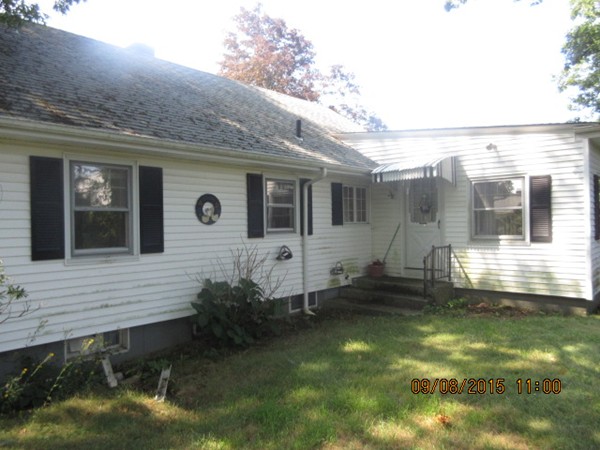 68 Durfee Road Tiverton, RI 02878 - Photo 3 of 22 a front view of a house with a yard