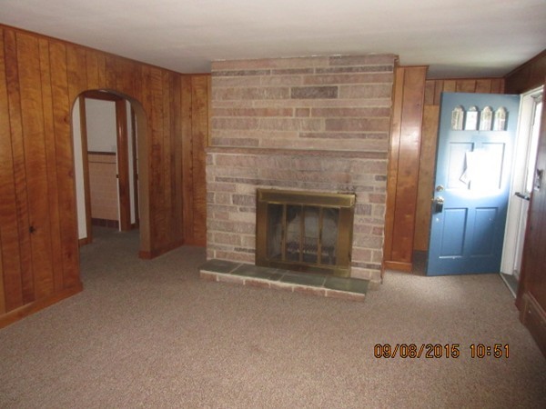 68 Durfee Road Tiverton, RI 02878 - Photo 7 of 22 a view of empty room with a fireplace