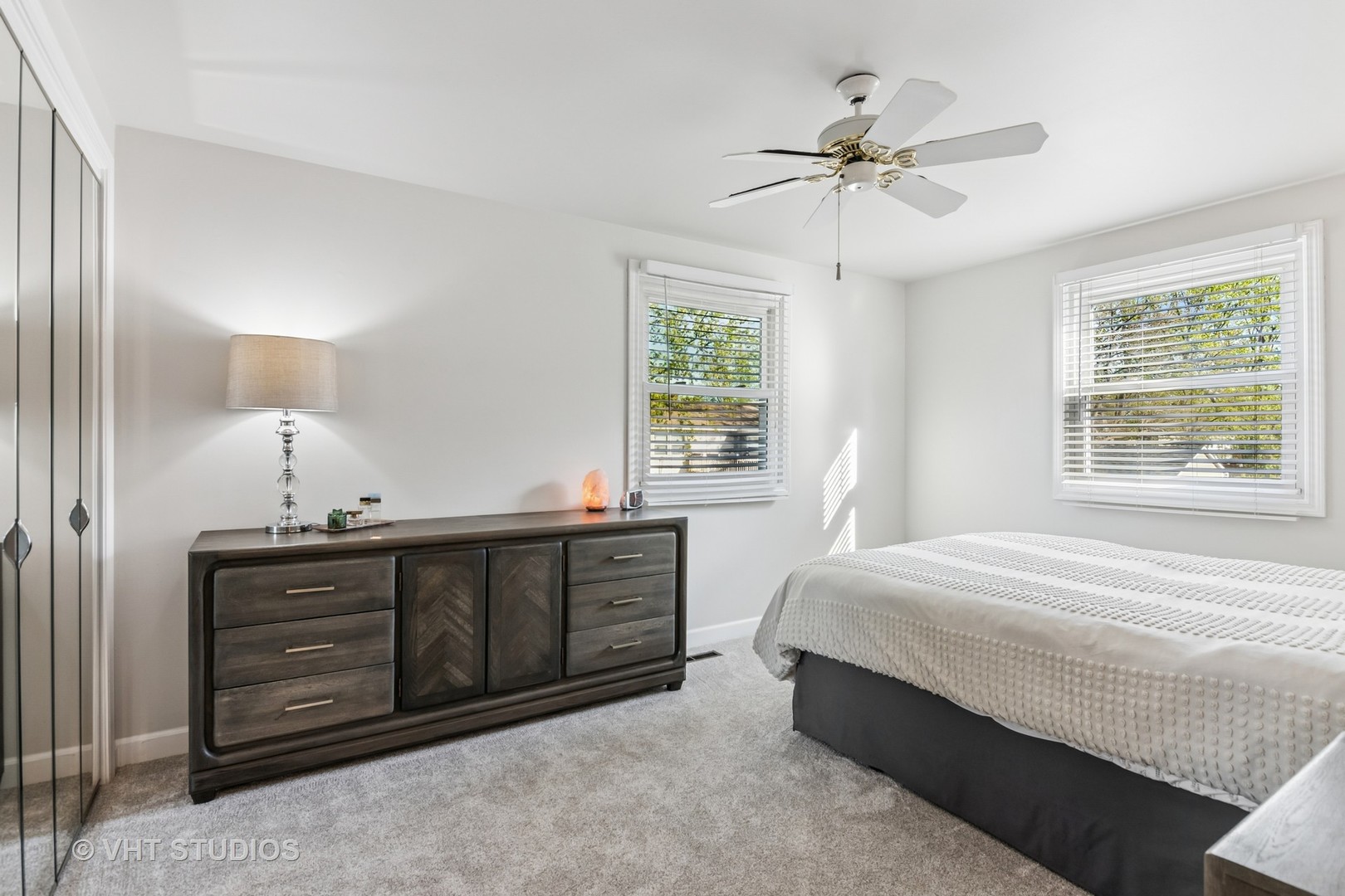 389 Weidner Road Buffalo Grove, IL 60089 - Photo 13 of 25 a bedroom with a bed and a chandelier