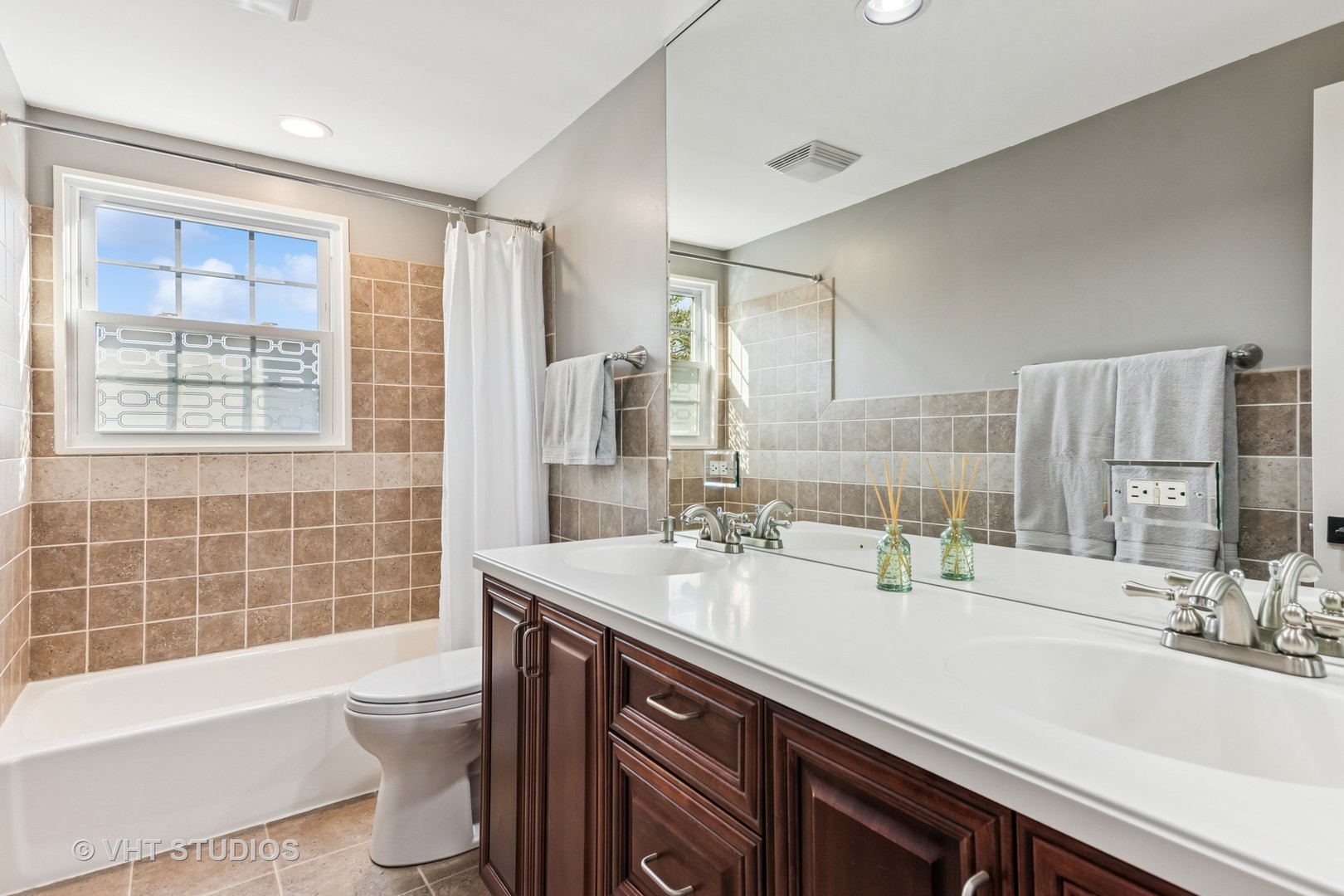 389 Weidner Road Buffalo Grove, IL 60089 - Photo 15 of 25 a bathroom with a double vanity sink toilet and shower