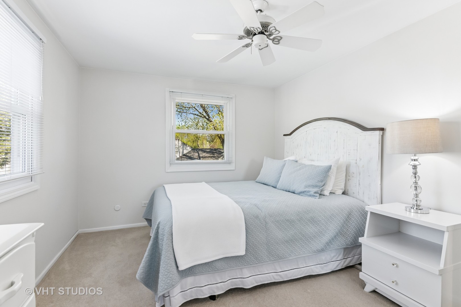 389 Weidner Road Buffalo Grove, IL 60089 - Photo 18 of 25 a bedroom with a bed and a chandelier