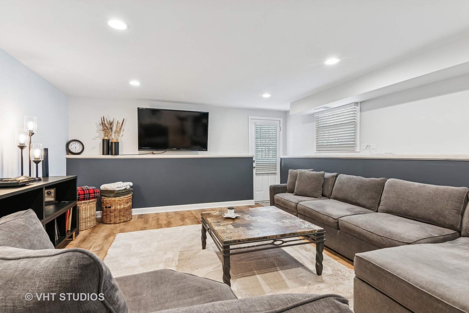 389 Weidner Road Buffalo Grove, IL 60089 - Photo 19 of 25 a living room with furniture and a flat screen tv