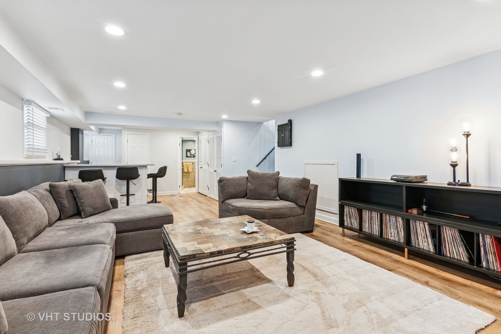 389 Weidner Road Buffalo Grove, IL 60089 - Photo 21 of 25 a living room with furniture and a flat screen tv