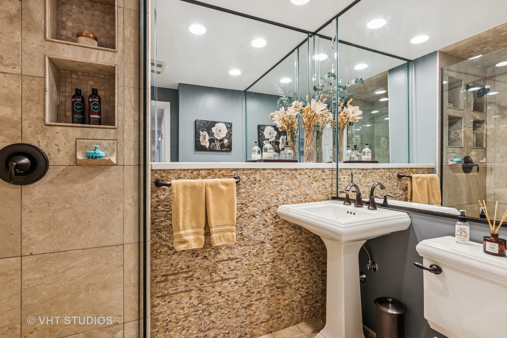 389 Weidner Road Buffalo Grove, IL 60089 - Photo 22 of 25 a bathroom with a sink a mirror and shower