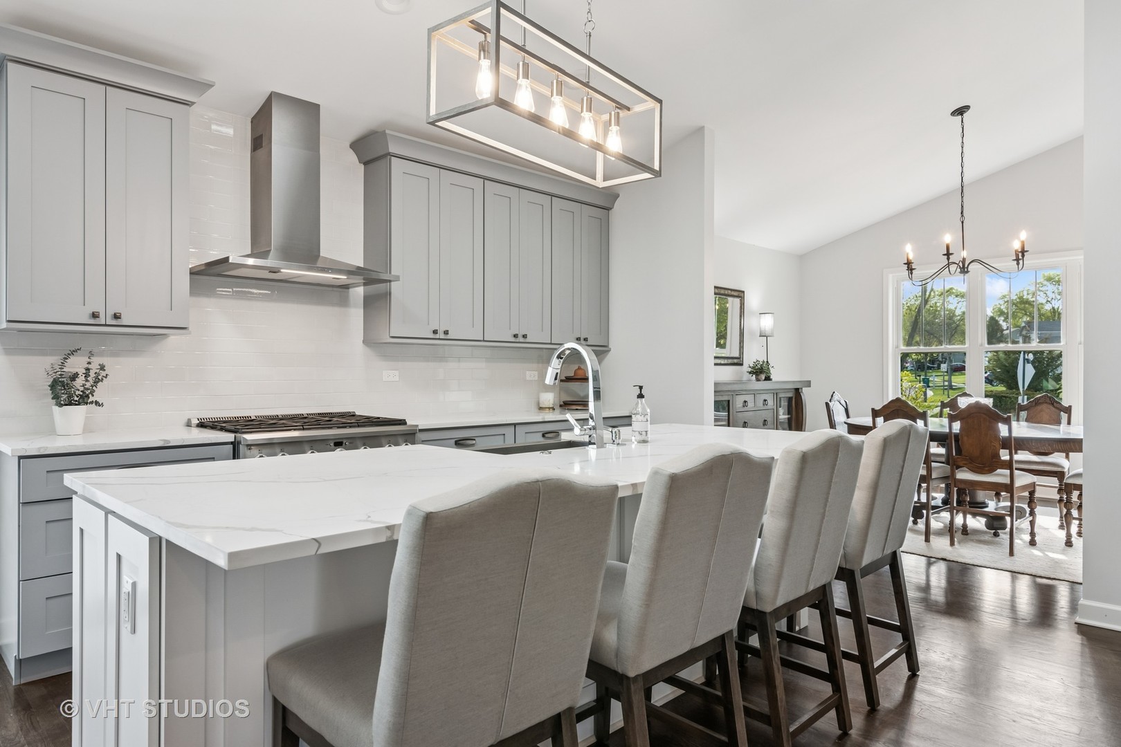 389 Weidner Road Buffalo Grove, IL 60089 - Photo 9 of 25 a kitchen with a table chairs stove and cabinets