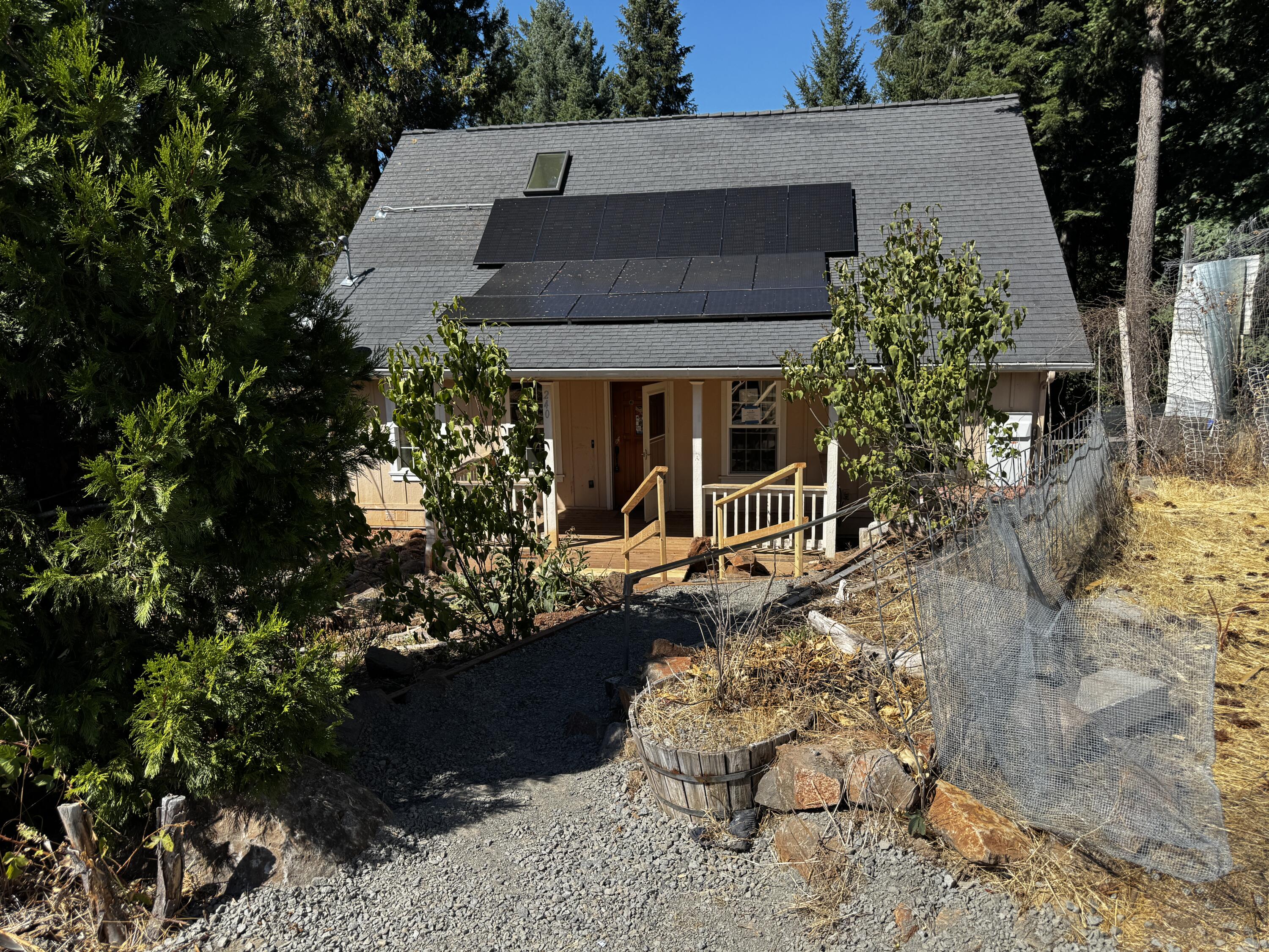 240 Bluff Street Butte Falls, OR 97522 - Photo 1 of 34 a view of a house with a yard and sitting area