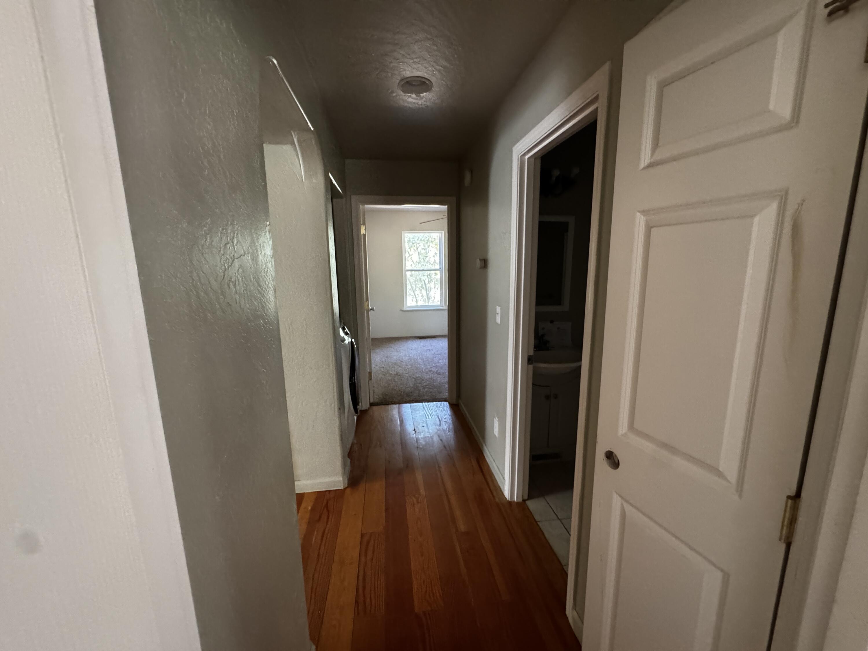240 Bluff Street Butte Falls, OR 97522 - Photo 23 of 34 a view of hallway with wooden floor