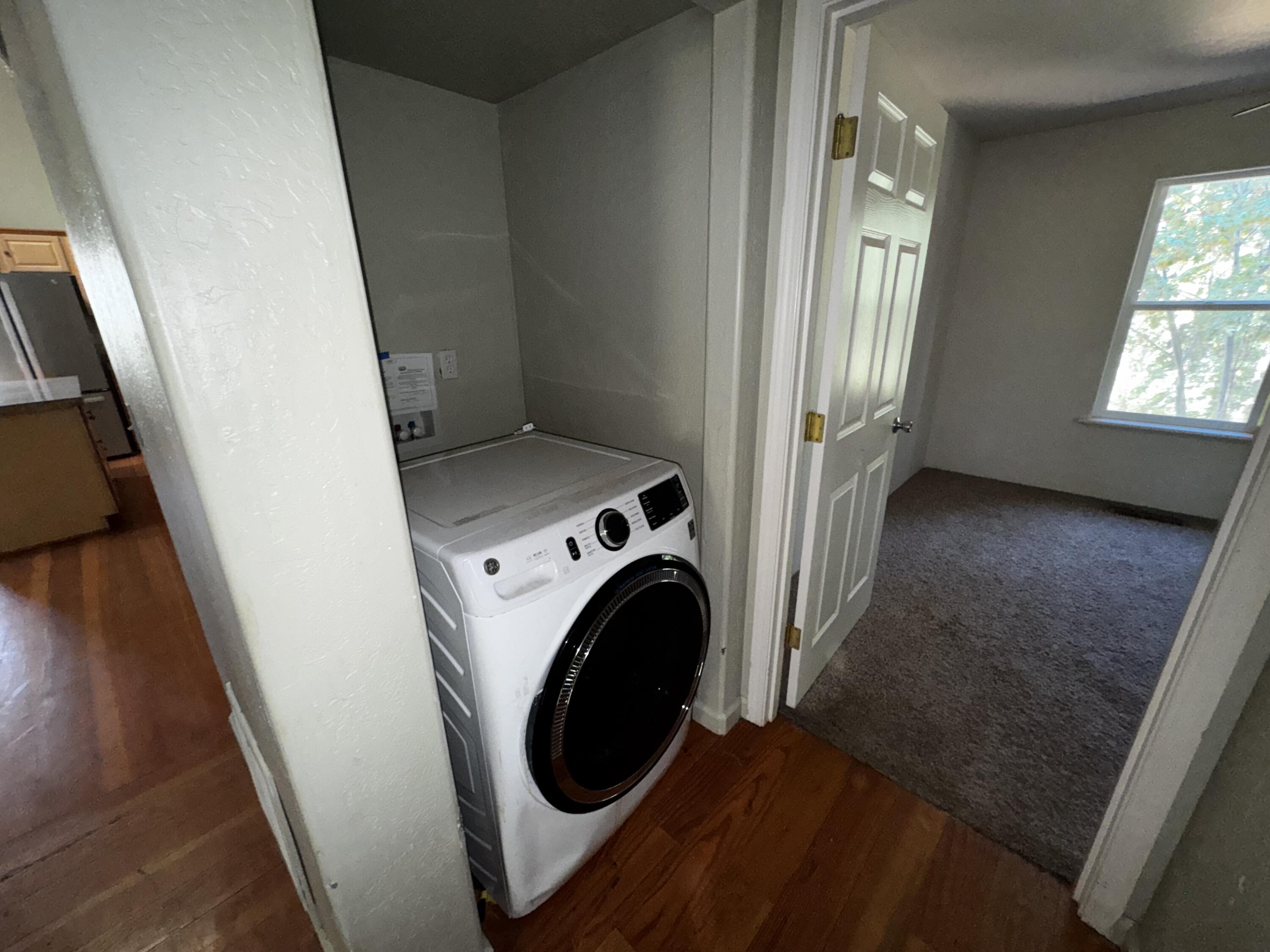 240 Bluff Street Butte Falls, OR 97522 - Photo 24 of 34 a view of a hallway with washer and dryer