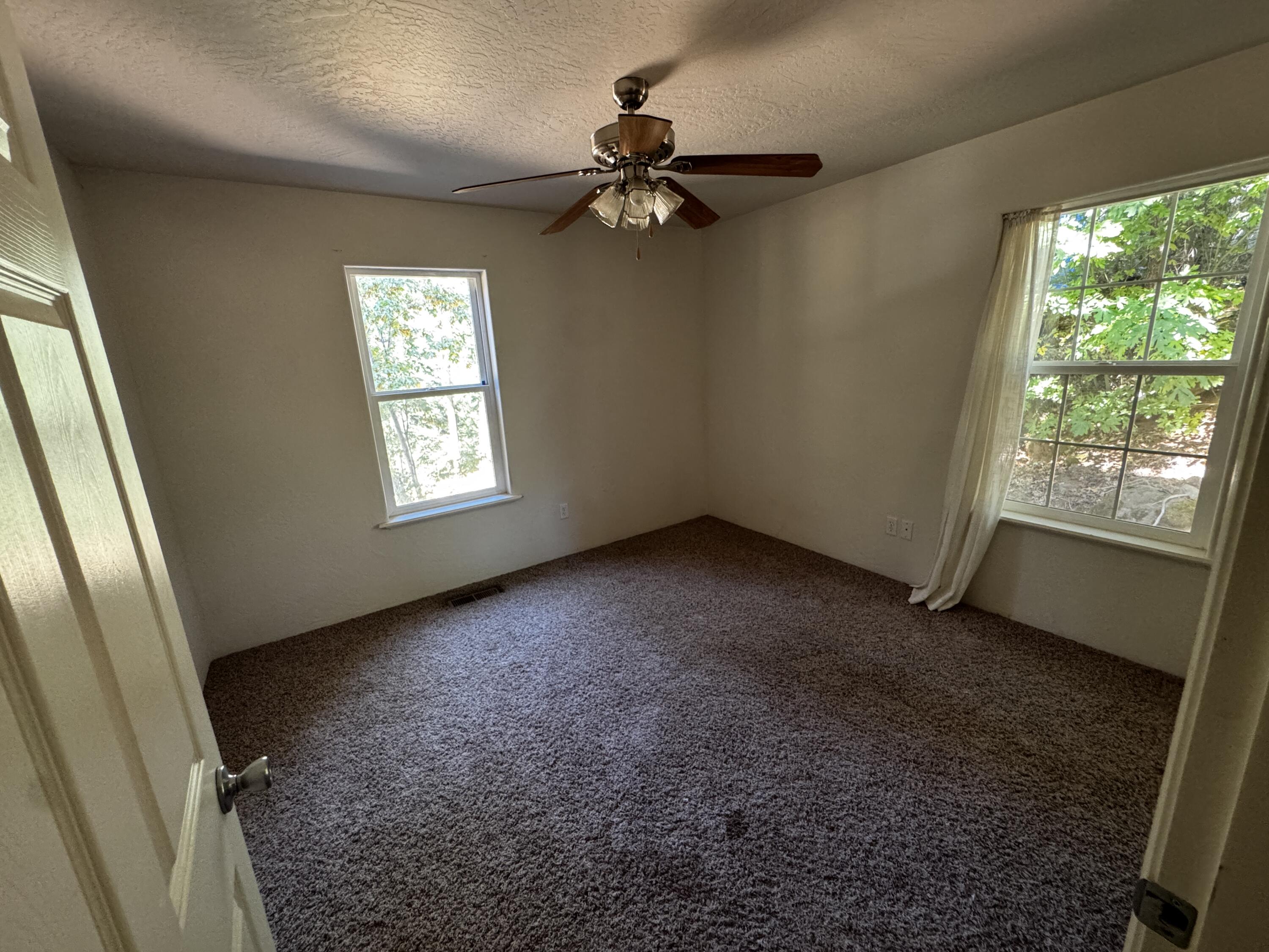 240 Bluff Street Butte Falls, OR 97522 - Photo 26 of 34 a view of an empty room and a window