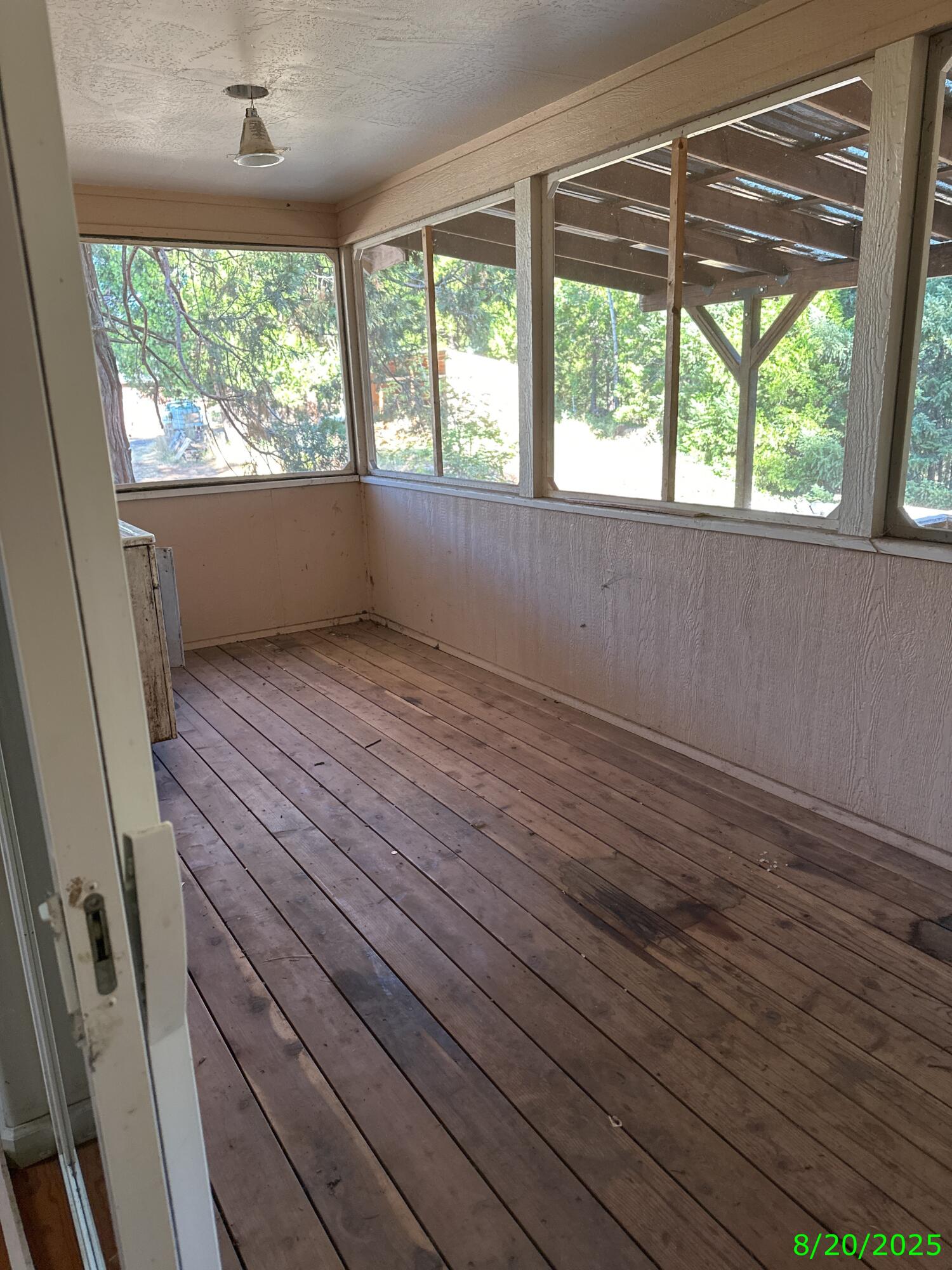 240 Bluff Street Butte Falls, OR 97522 - Photo 30 of 34 a view of an empty room with wooden floor and a window