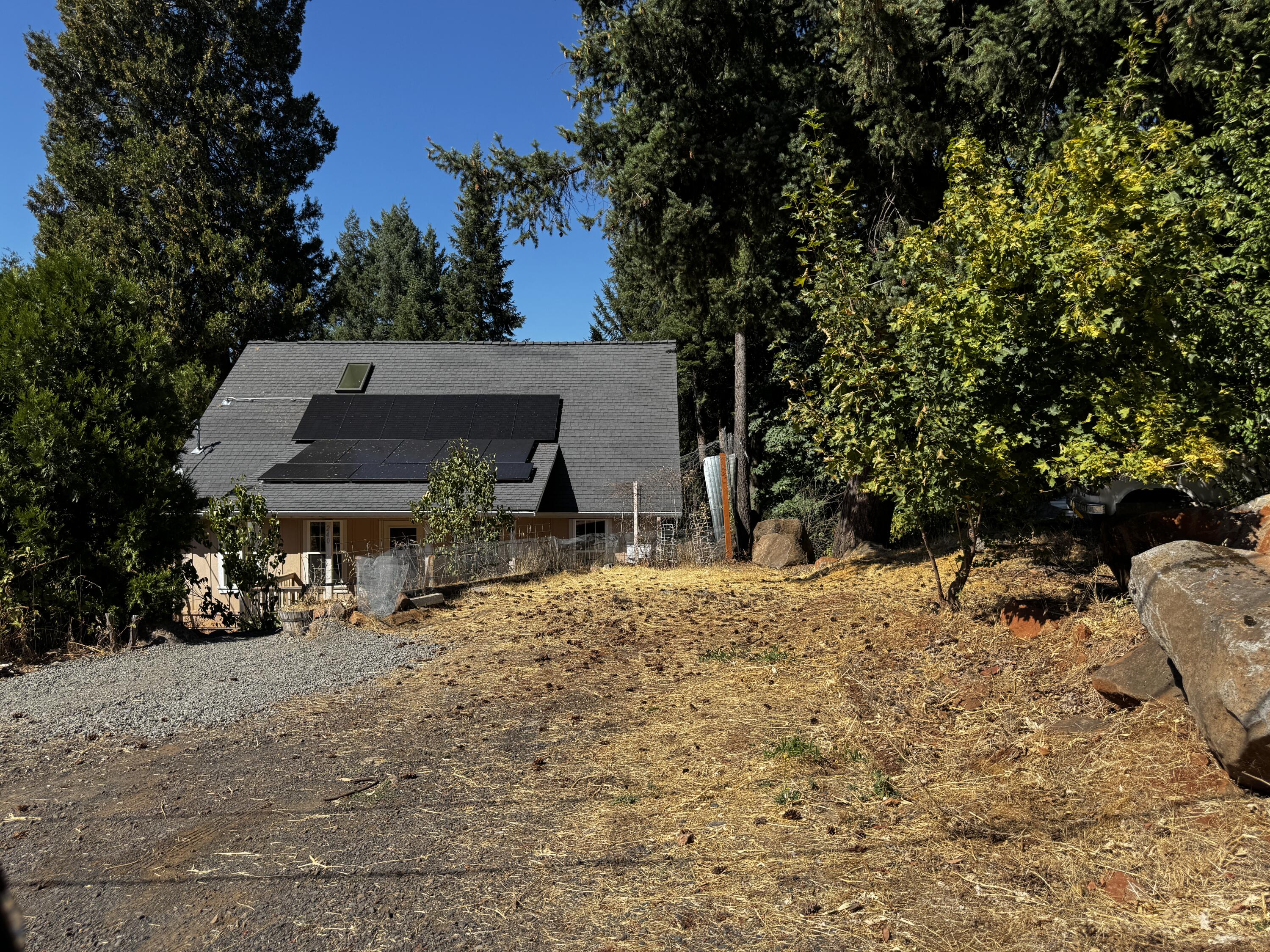 240 Bluff Street Butte Falls, OR 97522 - Photo 3 of 34 a view of a chairs and table in the backyard