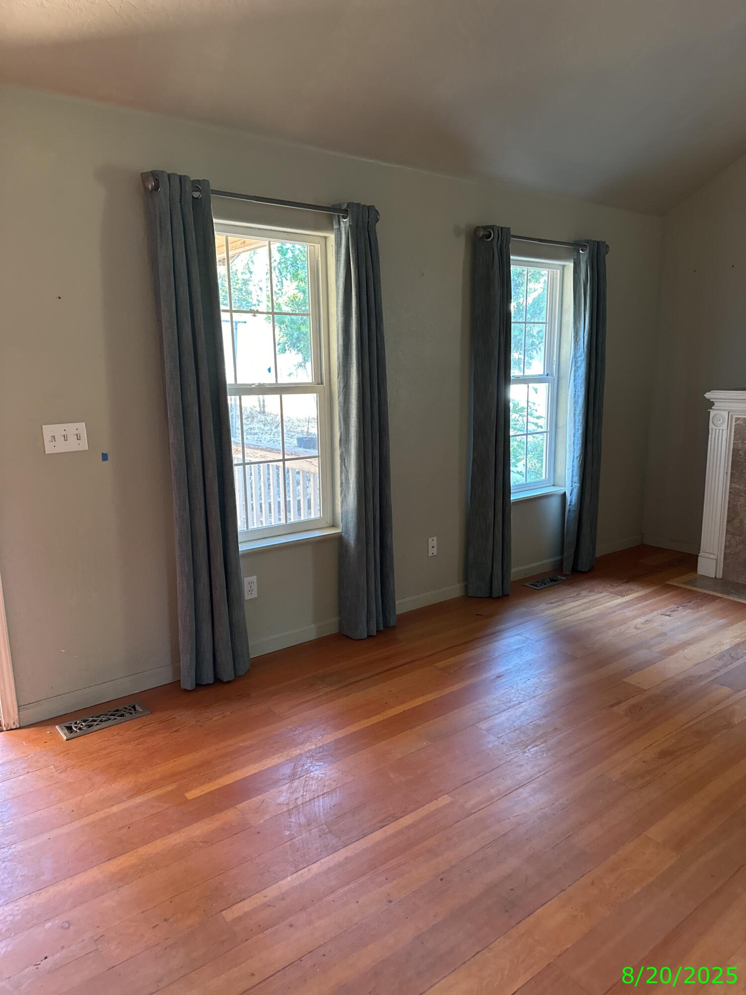 240 Bluff Street Butte Falls, OR 97522 - Photo 6 of 34 an empty room with wooden floor and windows