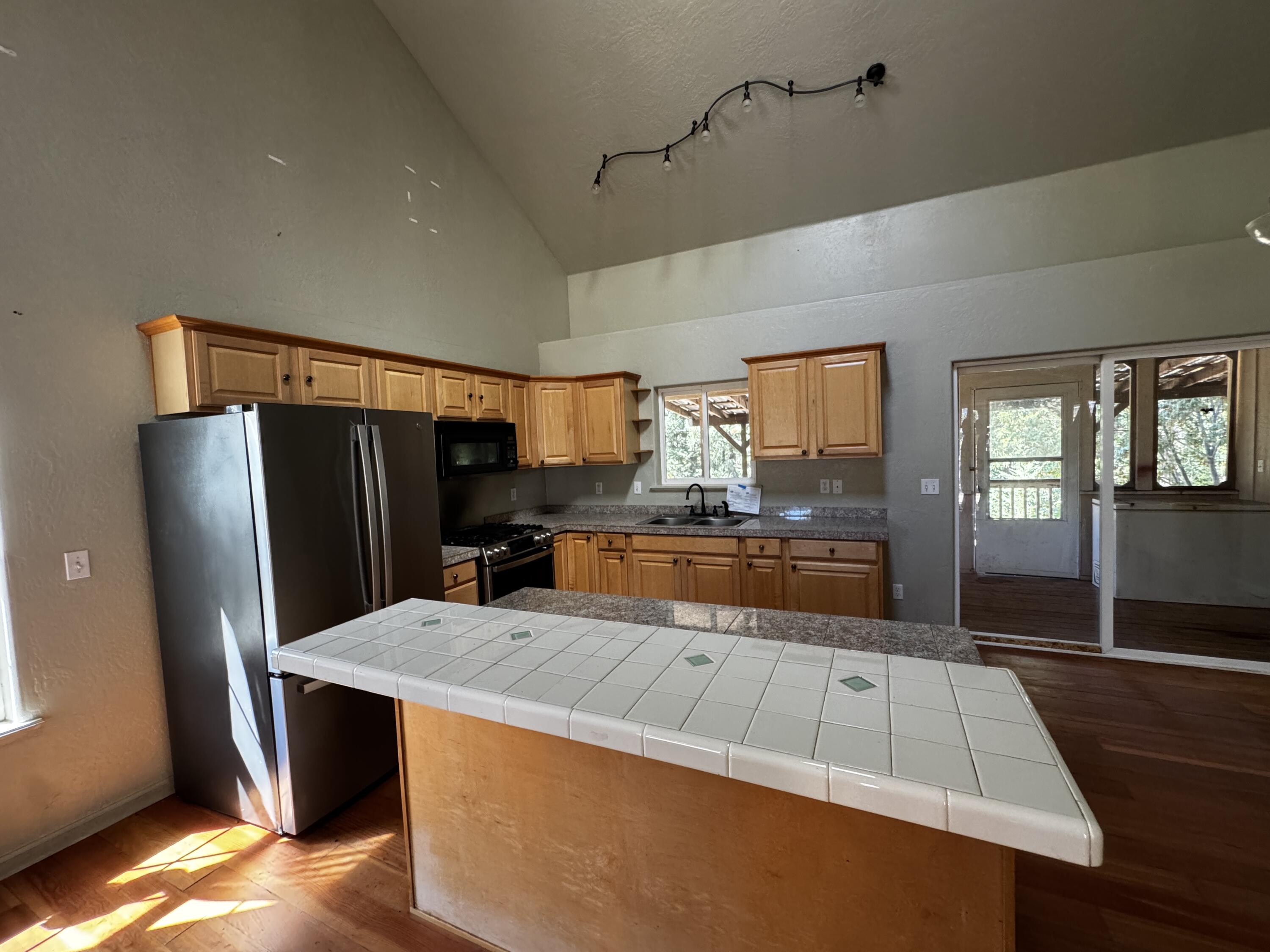 240 Bluff Street Butte Falls, OR 97522 - Photo 8 of 34 a view of kitchen with cabinets and refrigerator