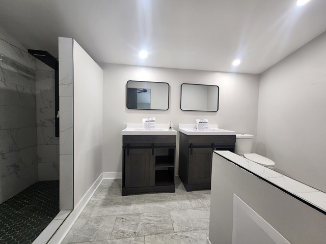 15441 East End Street Dolton, IL 60419 - Photo 15 of 16 a bathroom with a double vanity sink and mirror