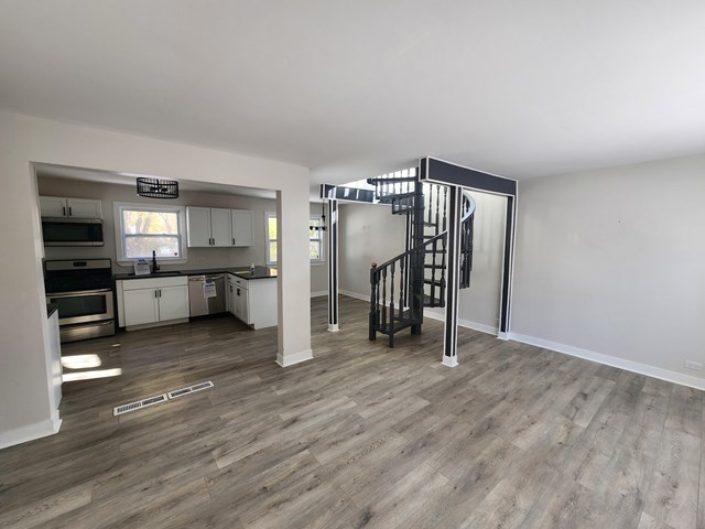 15441 East End Street Dolton, IL 60419 - Photo 6 of 16 a view of a kitchen with a sink and a refrigerator