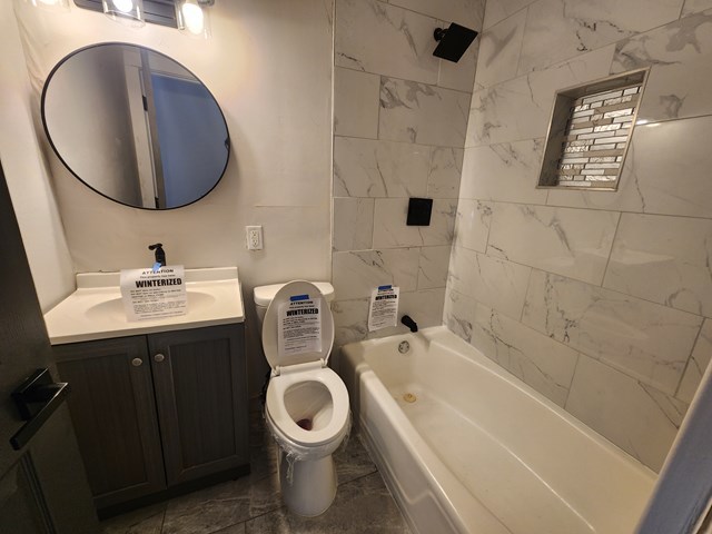 15441 East End Street Dolton, IL 60419 - Photo 8 of 16 a bathroom with a toilet sink and mirror