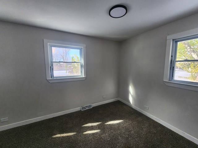 15441 East End Street Dolton, IL 60419 - Photo 9 of 16 an empty room with a window