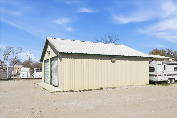 a front view of a house with a road