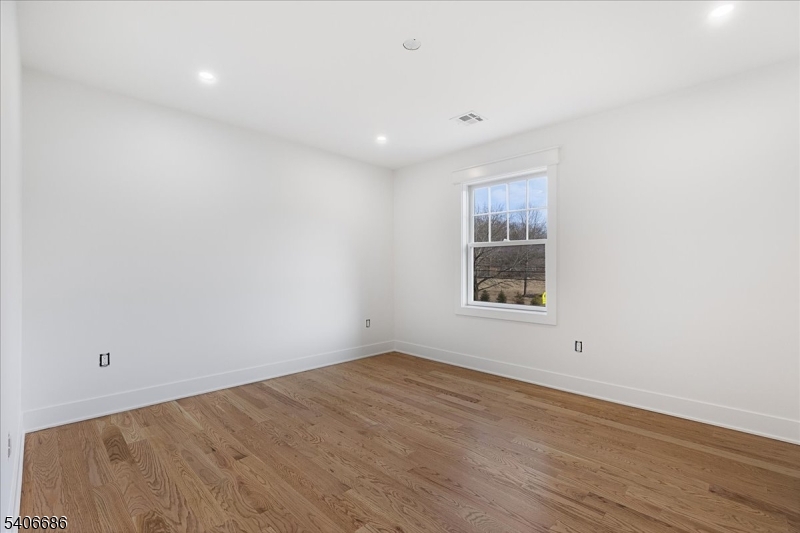 759 Mechlin Corner Road Hampton, NJ 08827 - Photo 39 of 45 a view of an empty room with wooden floor and a window