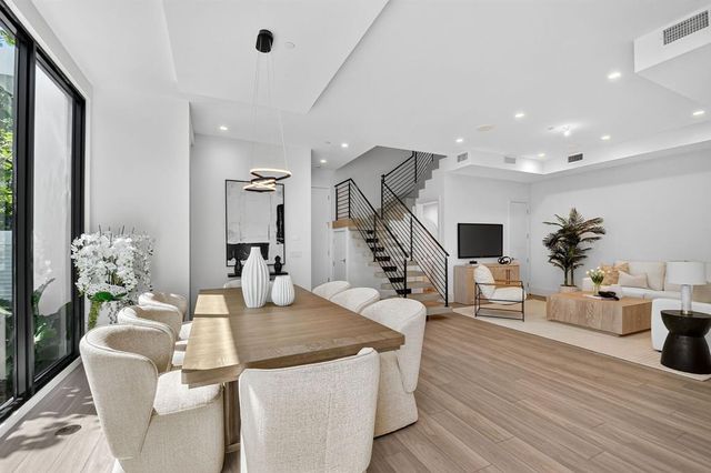 a view of kitchen with cabinets and wooden floor