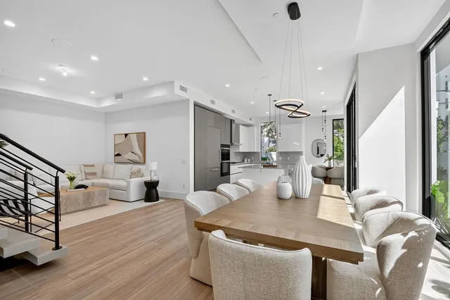 a bathroom with a granite countertop sink a potted plant and a mirror