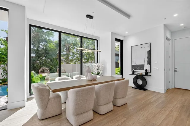 a bedroom with a large bed and a large window