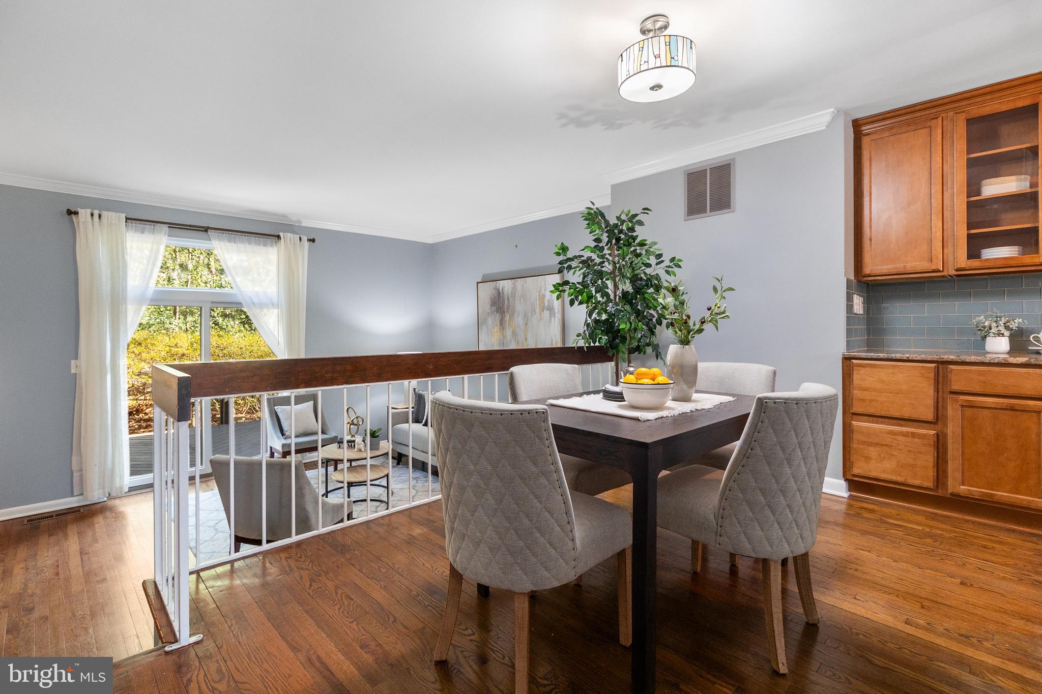 2010 Golf Course Drive Reston, VA 20191 - Photo 8 of 28 a view of a dining room with furniture and wooden floor