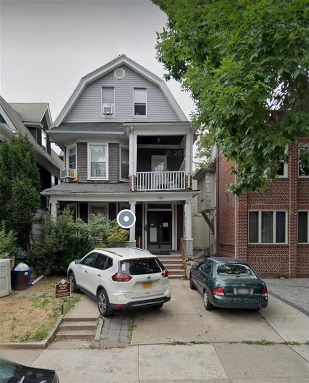 a car parked in front of a house