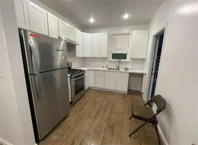 a kitchen with a refrigerator a sink and dishwasher