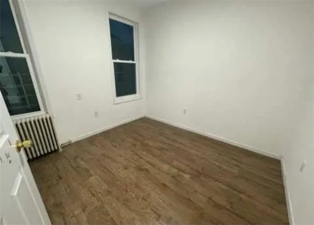 a view of an empty room with stairs