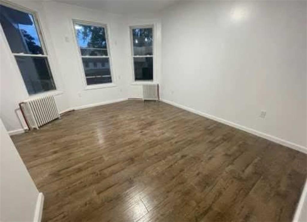 546 East 9th Street Brooklyn, NY 11218 - Photo 7 of 8 an empty room with windows
