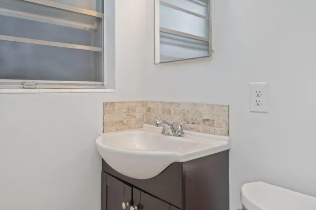 a bathroom with a sink and a toilet