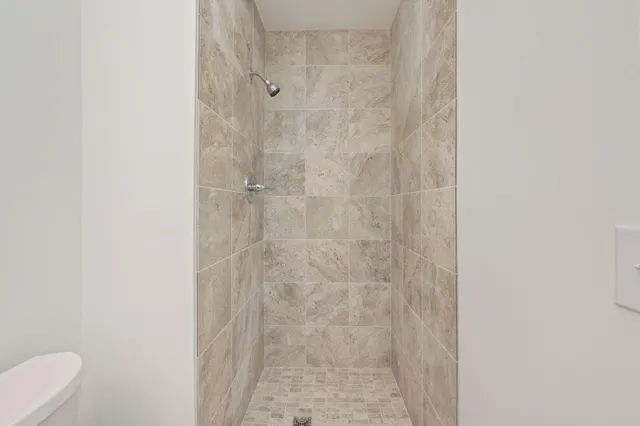 a bathroom with a white toilet