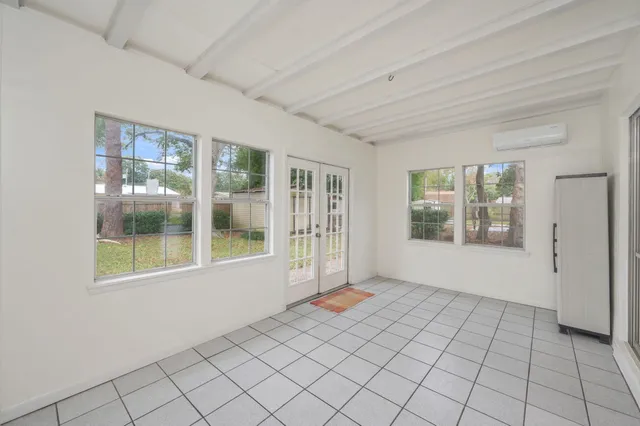a view of an empty room with windows