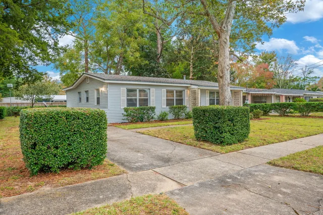 front view of a house with a garden