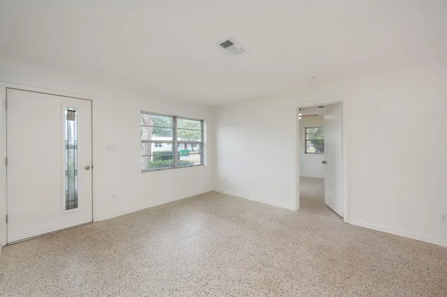 a view of an empty room with a window