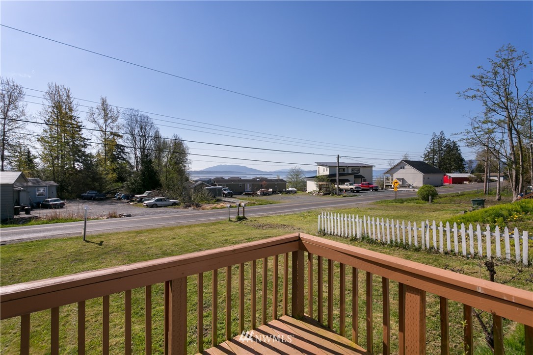 3676 North Red River Road Ferndale, WA 98248 - Photo 2 of 26 a view of a deck with a big yard and a large trees
