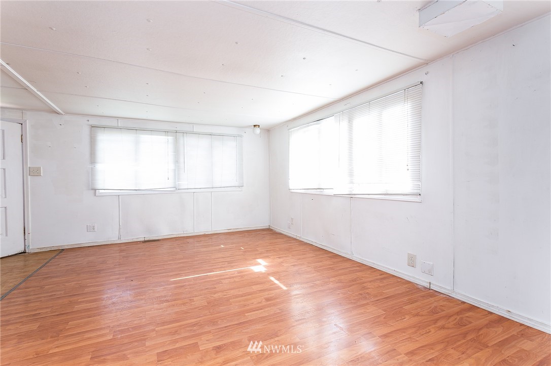 3676 North Red River Road Ferndale, WA 98248 - Photo 18 of 26 an empty room with wooden floor and windows