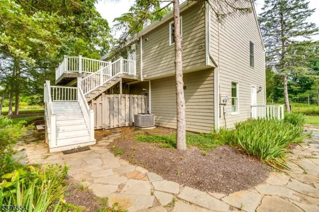 a view of house with yard